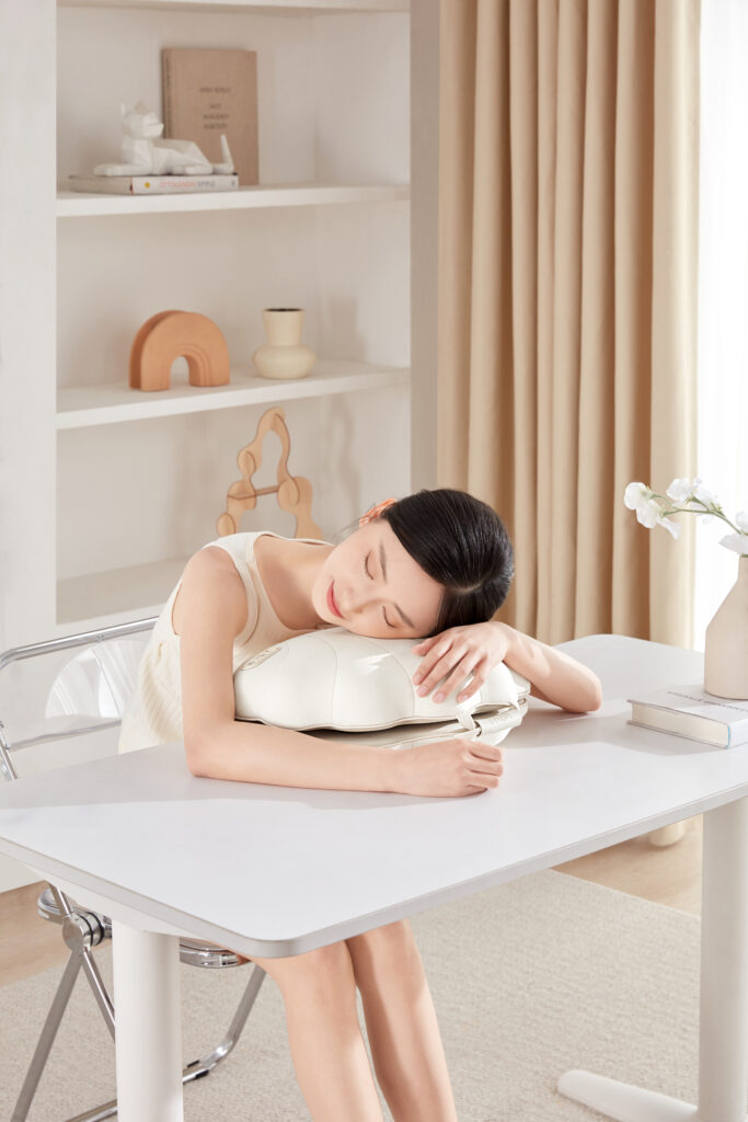 a woman sleeping on a white table
